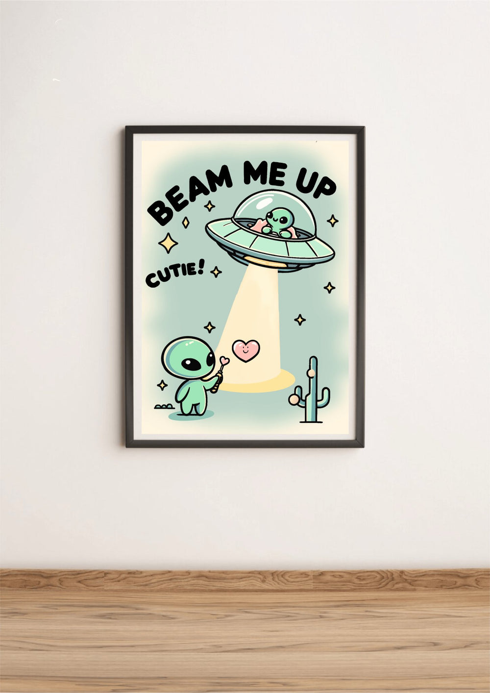 A "Beam Me Up, Cutie" waterproof sticker from  KEOLIX adorns a wooden gift box with a green ribbon, placed on a festive table amidst holiday ornaments and gingerbread cookies. The sticker features whimsical artwork of a cartoon baby alien alongside the text, "This gift is outta this world," inviting you on a cosmic adventure.