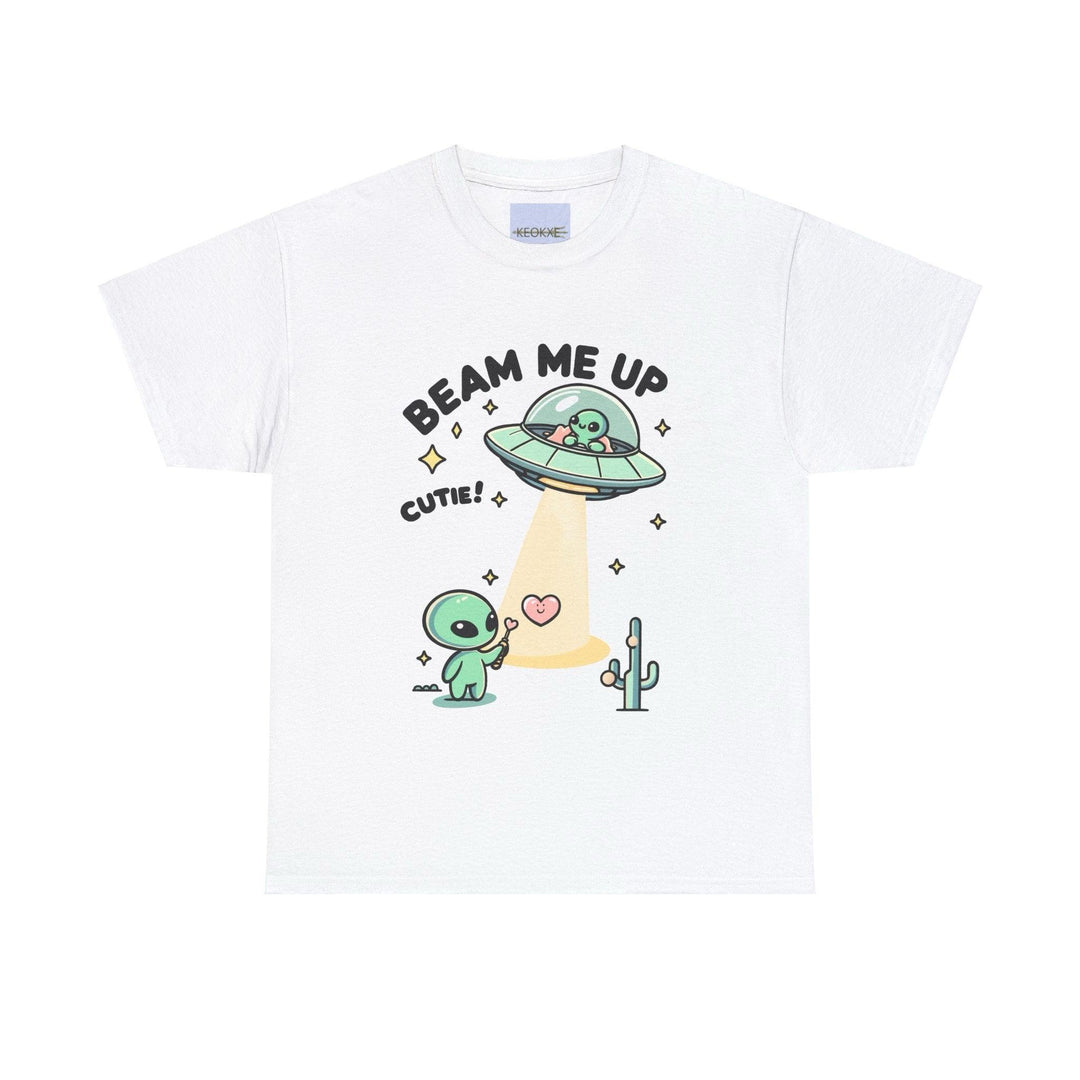 White T-shirt featuring an adorable alien in a flying saucer beaming up a cartoon character, with the playful text 'Beam Me Up, Cutie!' A fun and light-hearted design for lovers of sci-fi and cute illustrations."
