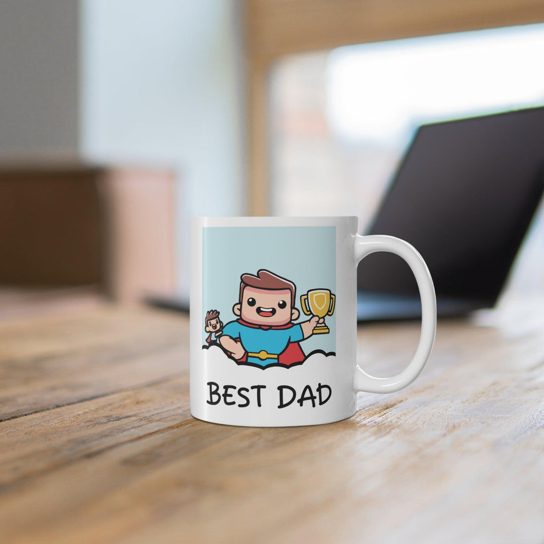White ceramic mug featuring a superhero dad illustration with the text 'Best Dad' on both sides, ideal for Father’s Day or any dad who loves a cuppa.