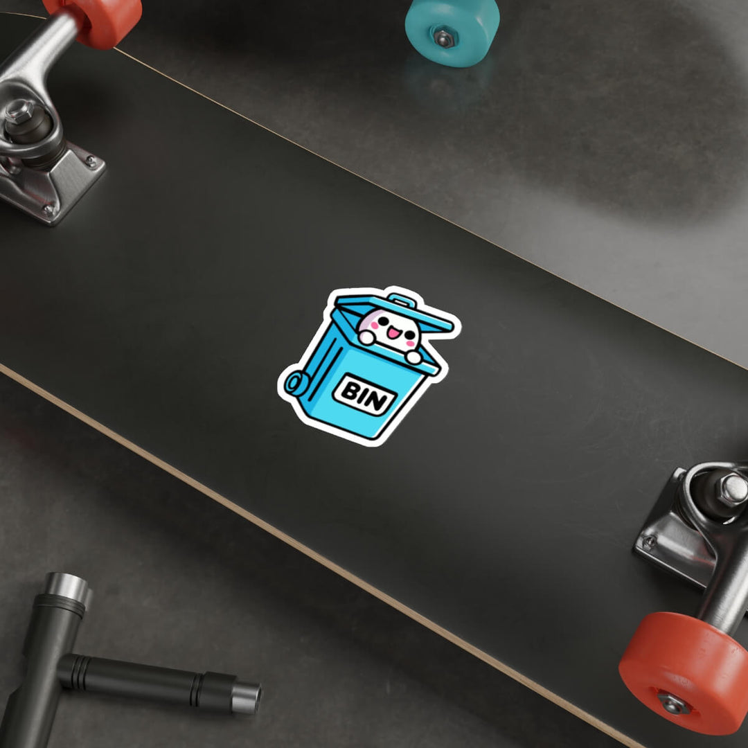 A humorous and cute sticker featuring a cartoon character with a happy face popping out of a blue trash bin labeled "BIN." Perfect for laptops or notebooks. Available as a single sticker, a pack of 3, or a pack of 6