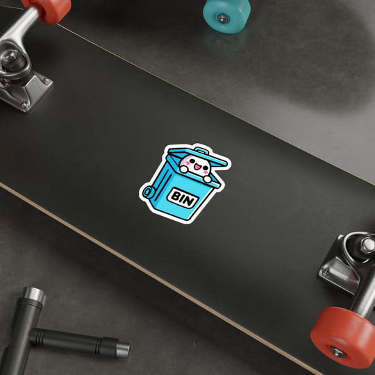 A humorous and cute sticker featuring a cartoon character with a happy face popping out of a blue trash bin labeled "BIN." Perfect for laptops or notebooks. Available as a single sticker, a pack of 3, or a pack of 6