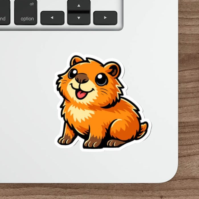 Cute illustrated capybara vinyl sticker on laptop, waterproof sticker with bold cartoon style.