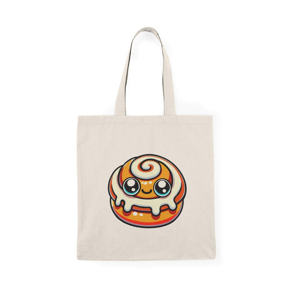 A tote bag featuring a charming kawaii-style cinnamon bun design on a natural canvas background, combining practicality with a playful aesthetic.

