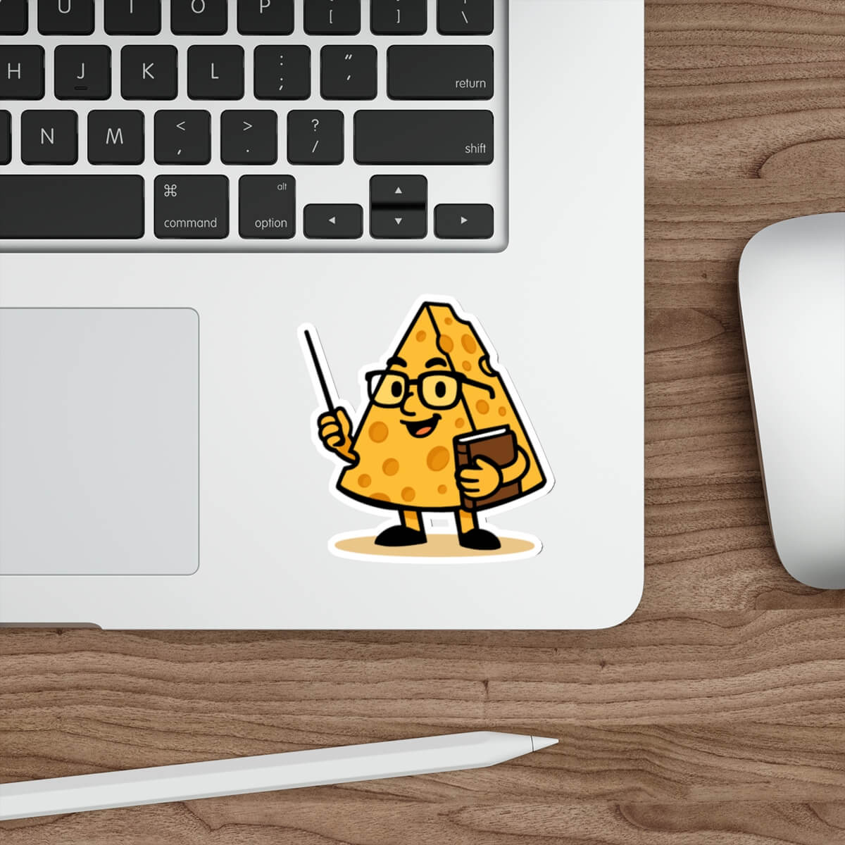 Cartoon-style vinyl sticker of a wedge of cheese with glasses and a book, smiling and giving a thumbs-up. Text reads: “This might be a bit cheesy… but you’re a brie-lliant teacher!”