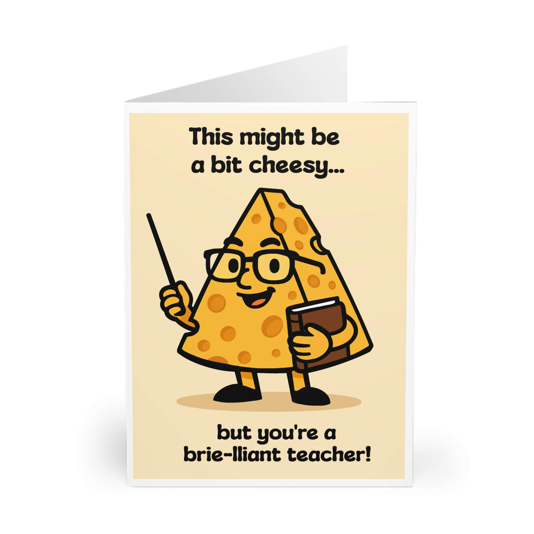 Greeting card with a cartoon wedge of cheese dressed as a teacher, holding a pointer and book, smiling. Caption reads: “This might be a bit cheesy… but you’re a brie-lliant teacher!” Card is upright on white background.

