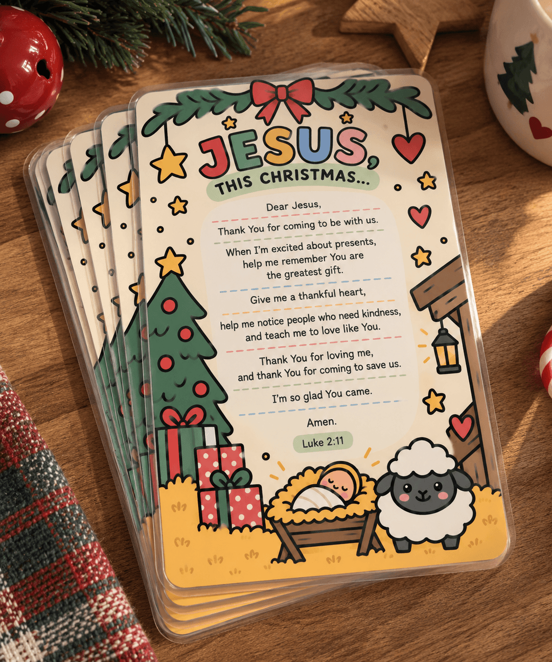 A stack of Christmas-themed scripture cards for Jesus, featuring a colorful illustrated cover with a nativity scene, gifts, sheep, and the text &