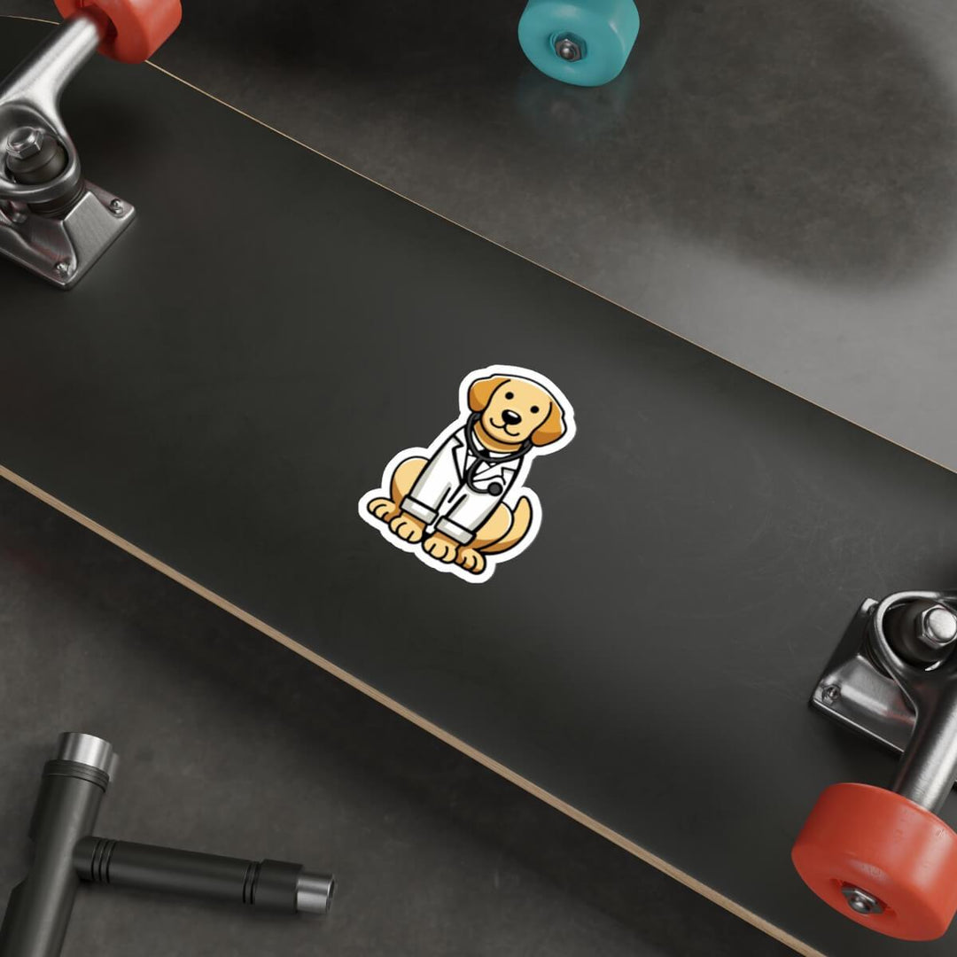 A cute, illustrated sticker of a golden retriever dressed as a doctor, wearing a white lab coat and stethoscope, placed on a sleek laptop near a keyboard and mouse on a wooden desk.