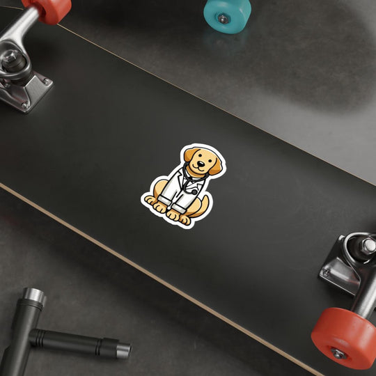 A cute, illustrated sticker of a golden retriever dressed as a doctor, wearing a white lab coat and stethoscope, placed on a sleek laptop near a keyboard and mouse on a wooden desk.