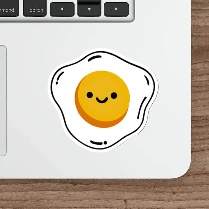 A cute waterproof egg sticker featuring a smiling fried egg design, perfect for decorating laptops, skateboards, and notebooks. Available in single or packs.

