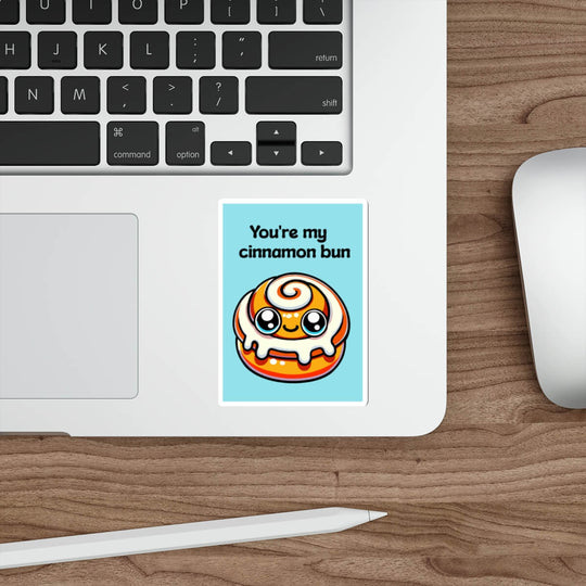 A whimsical sticker depicting a kawaii-style cinnamon bun with a caption "You&