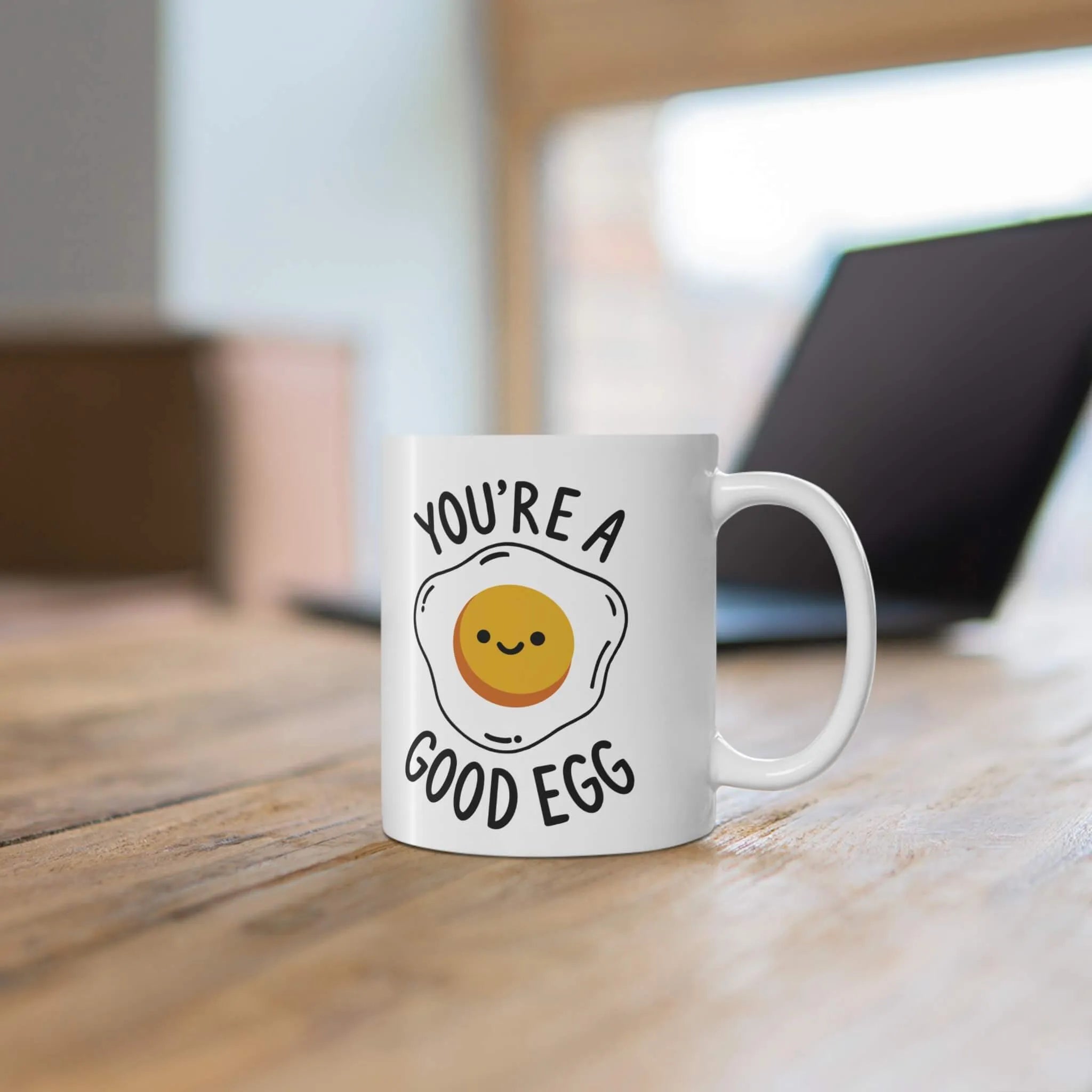 A ceramic mug with a glossy finish featuring a cheerful fried egg design and the phrase "You're a Good Egg." Perfect for coffee, tea, or gifting.

