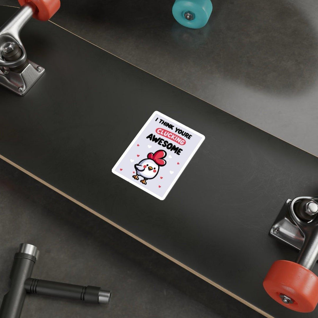 A skateboard on the ground features a vivid sticker from  KEOLIX on its deck, showcasing a cartoon chicken and the phrase "I Think You&