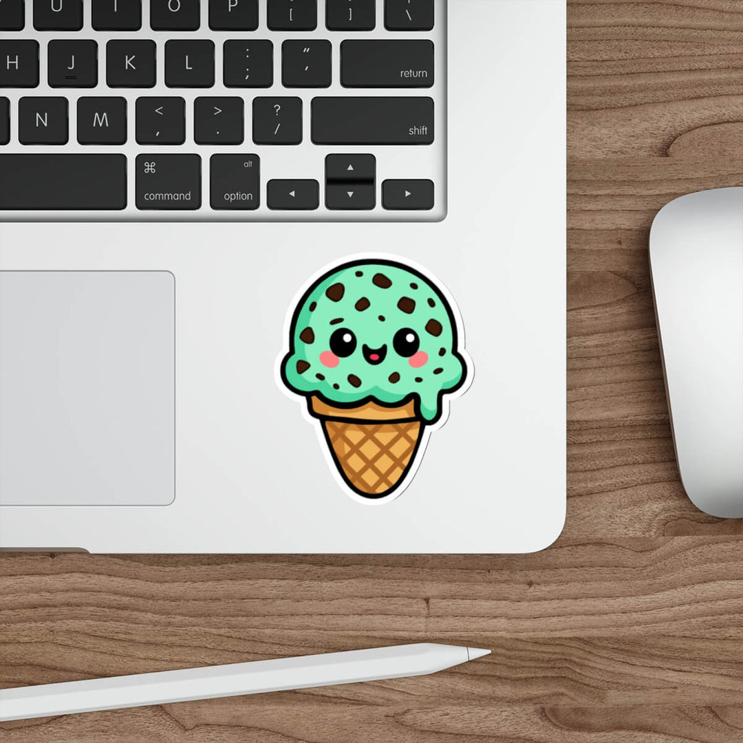 Cute mint chocolate chip ice cream sticker with kawaii smiley face, chocolate chip details, waffle cone base, on white background.