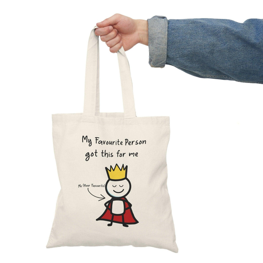 A natural canvas tote bag showcasing a charming illustration of a crowned character with the text 'My Favourite Person got me This' written in a playful font. The light-hearted design makes it an ideal gift for friends or loved ones, celebrating cherished relationships