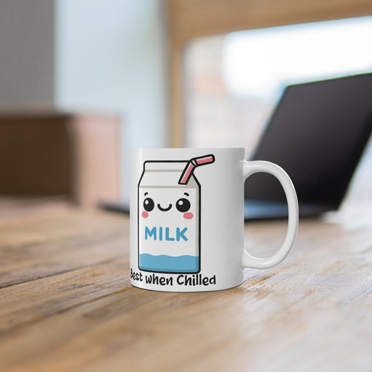 Mug with a cartoon milk carton design on a wooden surface
