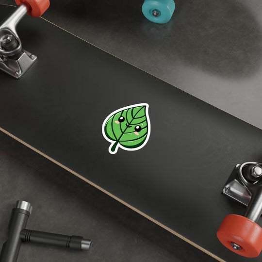 Cute green leaf sticker with a smiling face, featuring a kawaii-style design. Available as a single, pack of 3, or pack of 6 stickers.