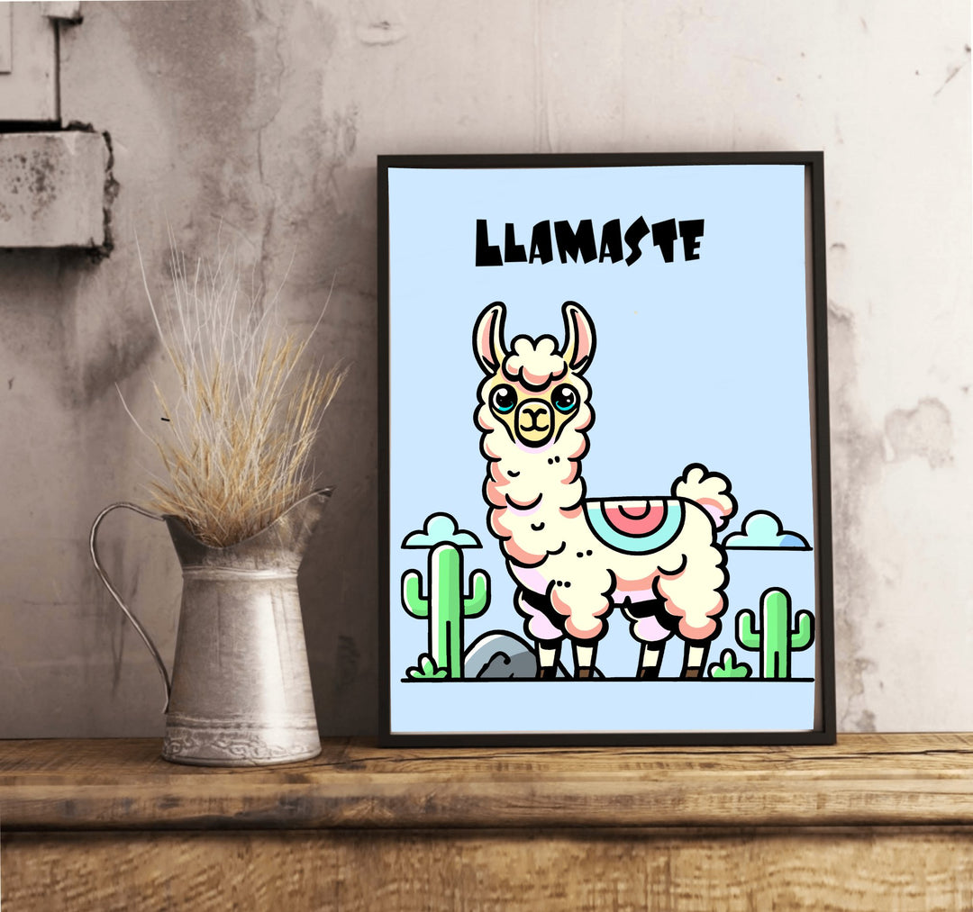 This "Llamaste" Art Print by Baby Keo brings a whimsical touch to your space, showcasing a framed cartoon llama with a serene expression surrounded by pastel-colored cacti on a light blue background. The word "Llamaste" is prominently displayed at the top, while the frame is set against a white wall on a wooden floor.