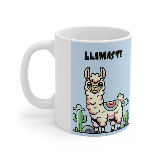 White ceramic mug featuring a charming llama in a yoga pose with the playful text 'Llamaste,' set against a neutral backdrop with cozy pinecones.