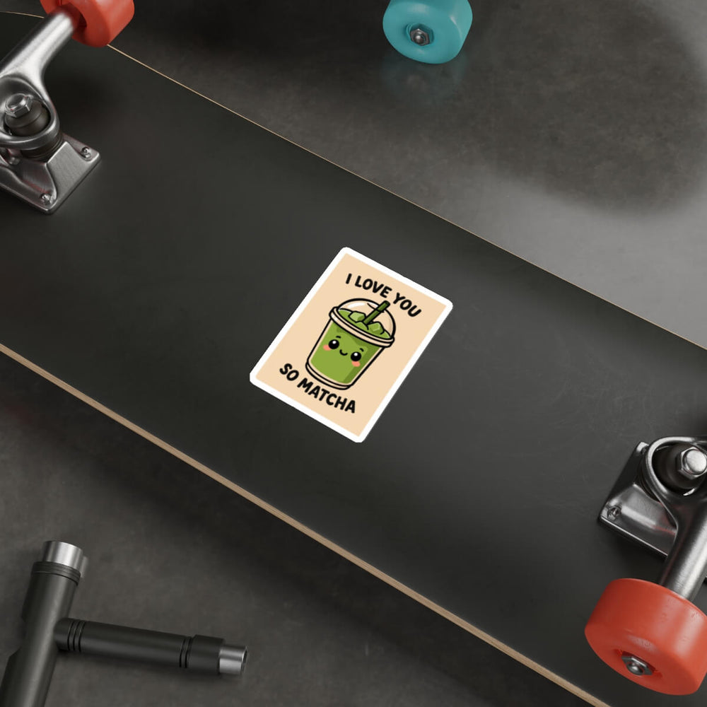 Cute green matcha drink sticker with smiling face and text that says “I Love You So Matcha,” shown on a laptop.