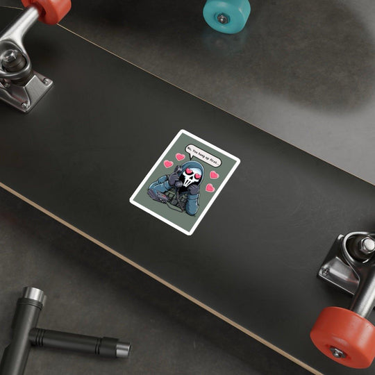 A skateboard is lying on the ground with a humorous design. In the center, there&