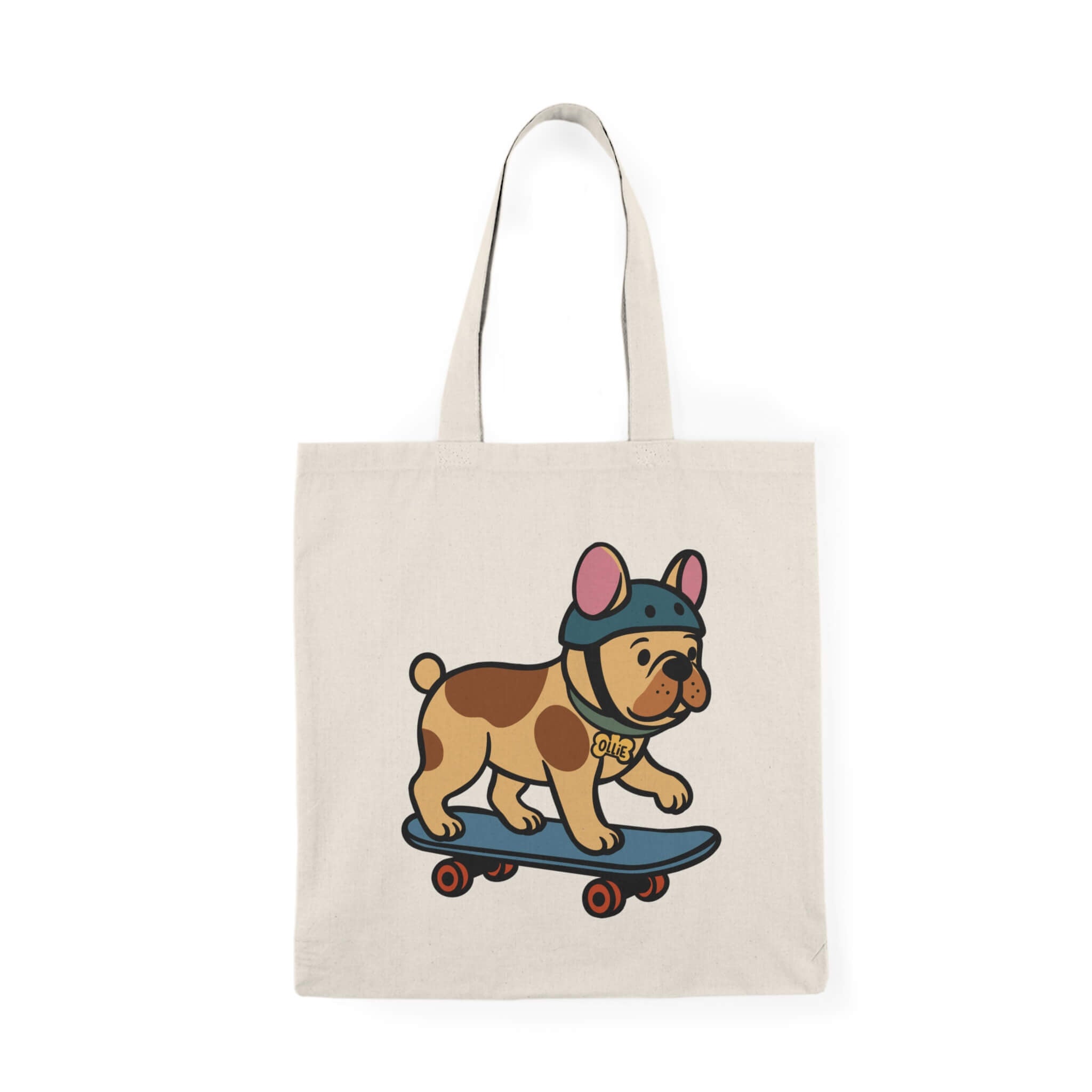 Canvas tote bag featuring a cartoon French bulldog named Ollie wearing a helmet and riding a blue skateboard, printed on a neutral beige cotton bag.