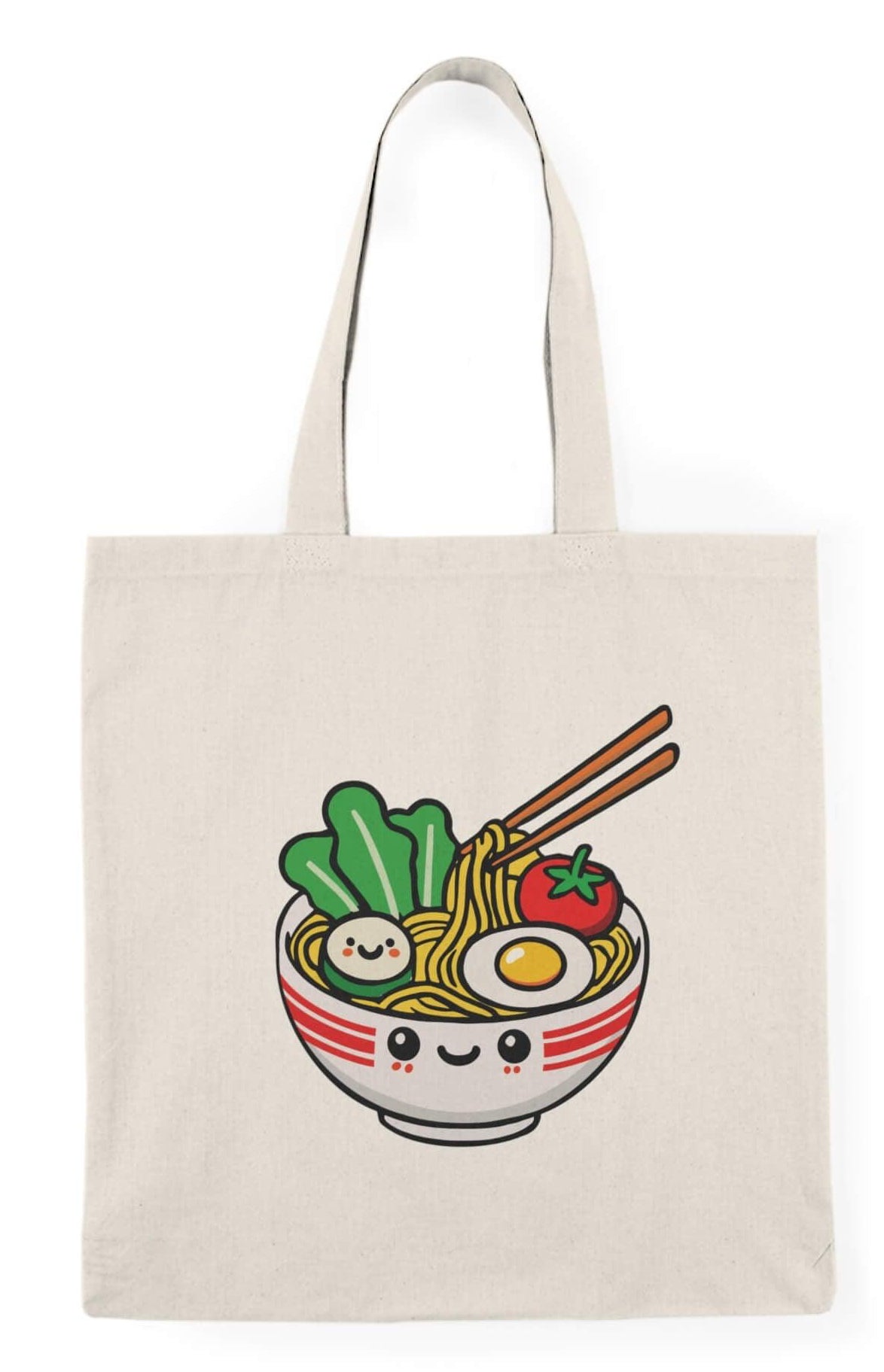 A beige cotton tote bag with a printed illustration of a smiling bowl of pho soup, including noodles, vegetables, and an egg.