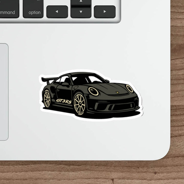 Stylized black sports car vinyl sticker inspired by luxury European track cars, placed on a laptop surface for aesthetic decoration. porsche gt3 rs