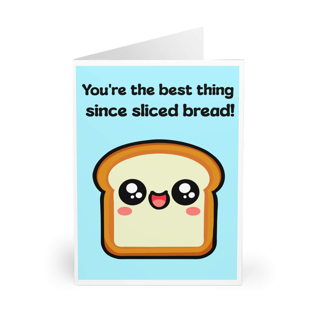 A cute and playful greeting card featuring an adorable, smiling slice of bread with rosy cheeks on a light blue background. The card reads, "You're the best thing since sliced bread!" in a bold, fun font. Perfect for expressing appreciation, love, or friendship in a lighthearted way.