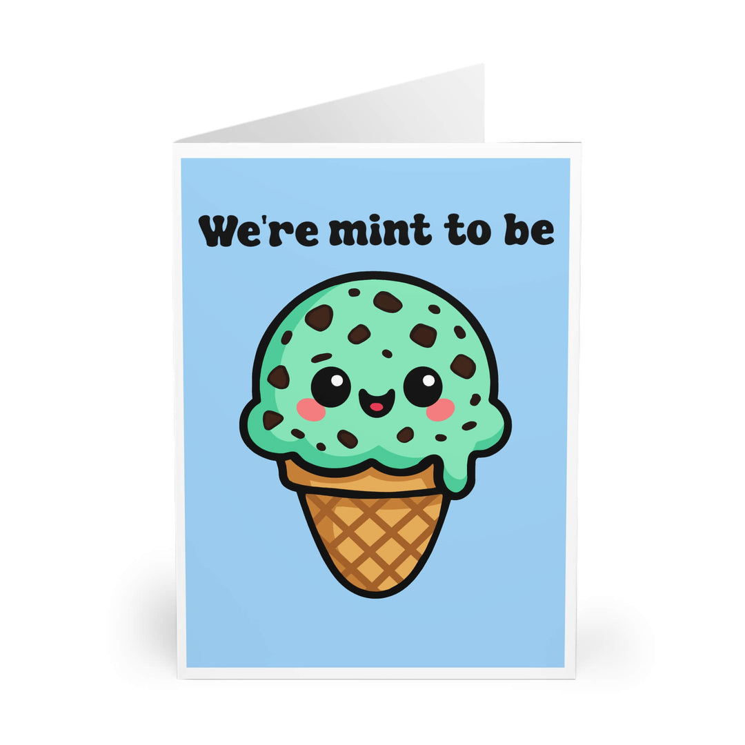 Kawaii mint chocolate chip ice cream pun card with “We’re mint to be” message, perfect for couples, printed on pastel blue background

