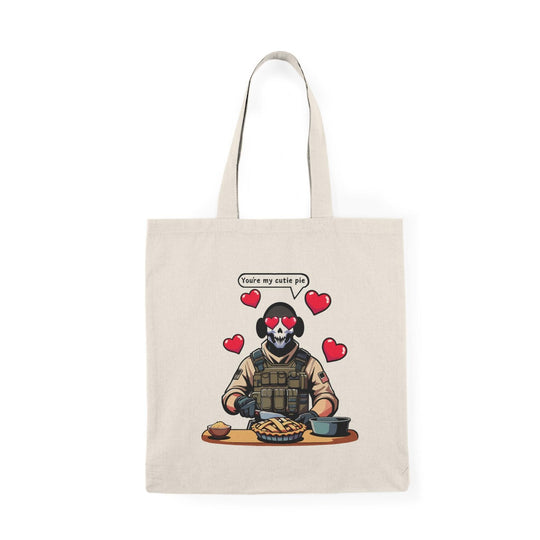 Tote bag featuring a playful illustration of a fearless soldier baking an apple pie, accompanied by the affectionate phrase 'You're My Cutie Pie.' The design combines elements of charm and humor, making it a perfect accessory for expressing love and sweetness in everyday life