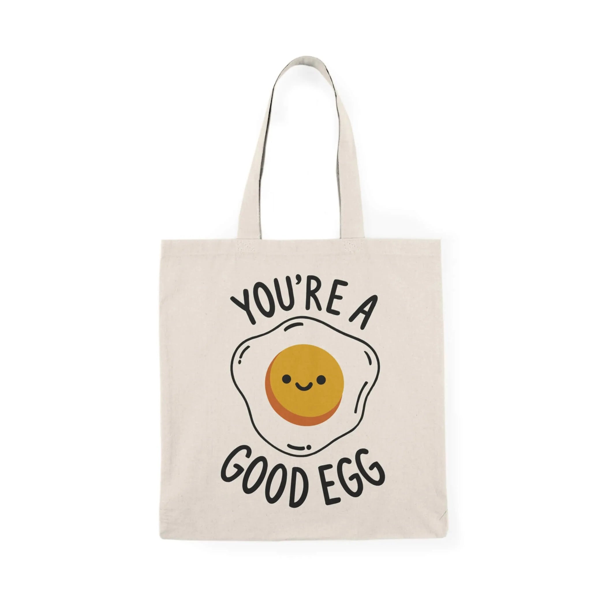 A reusable tote bag featuring a cute fried egg illustration with a smiling face on natural recycled cotton. Optionally includes "You're a Good Egg" text.