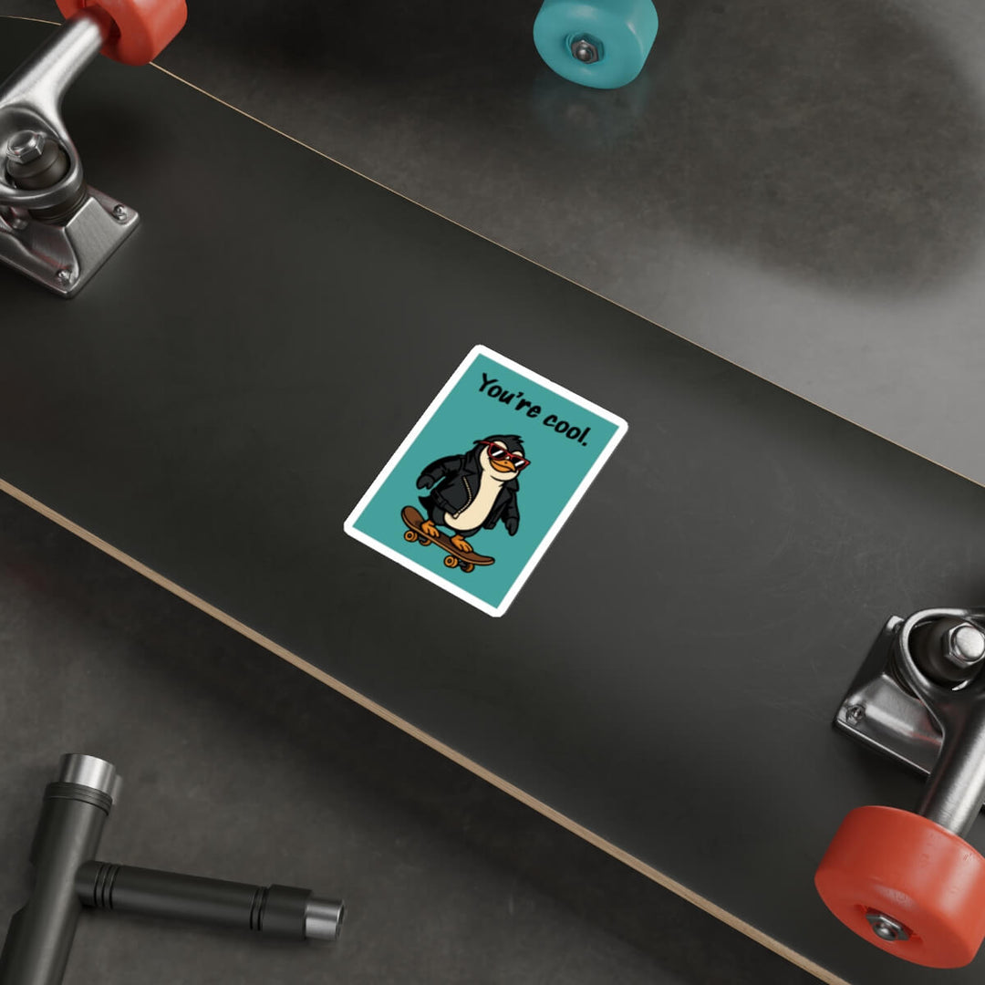 Sticker with a penguin design on a skateboard deck